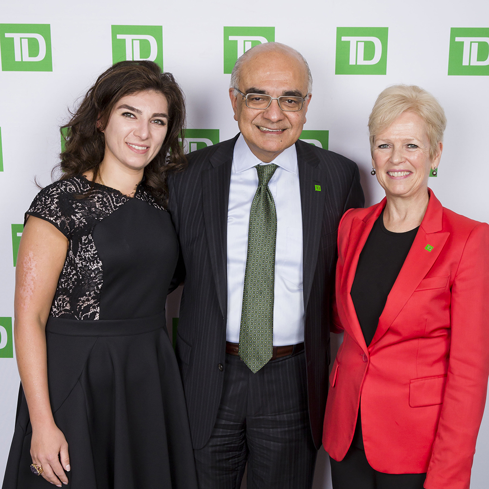 Bharat Masrani (BBA ’78, MBA ’79, Hon LLD ’17) standing with Colleen Johnston (BBA ’82, Hon LLD ’18), and a female Schulich alumni.