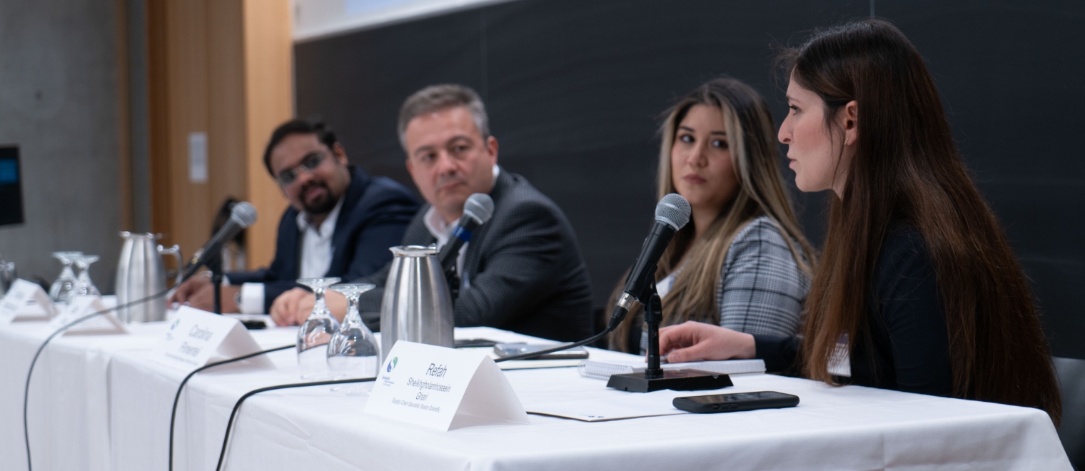 Side-view of four Schulich alumni panelists engaged in conversation.