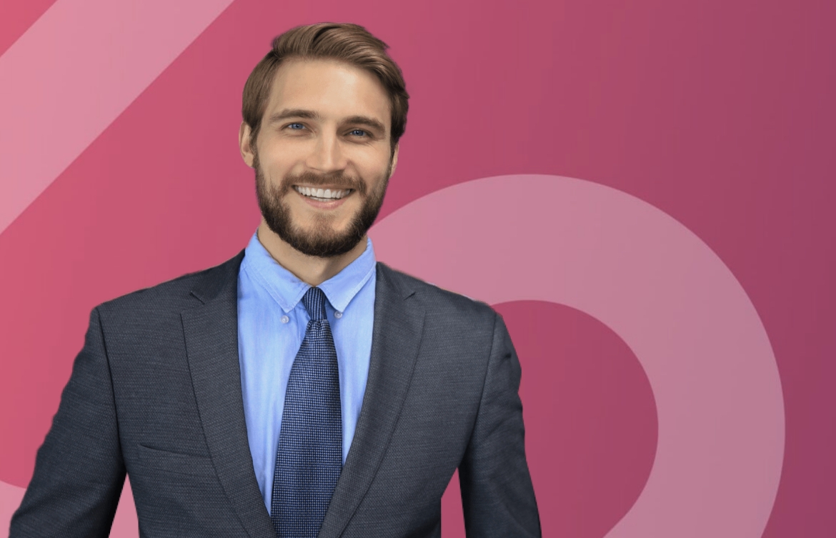 Male in business attire, pictured against a graphic background.