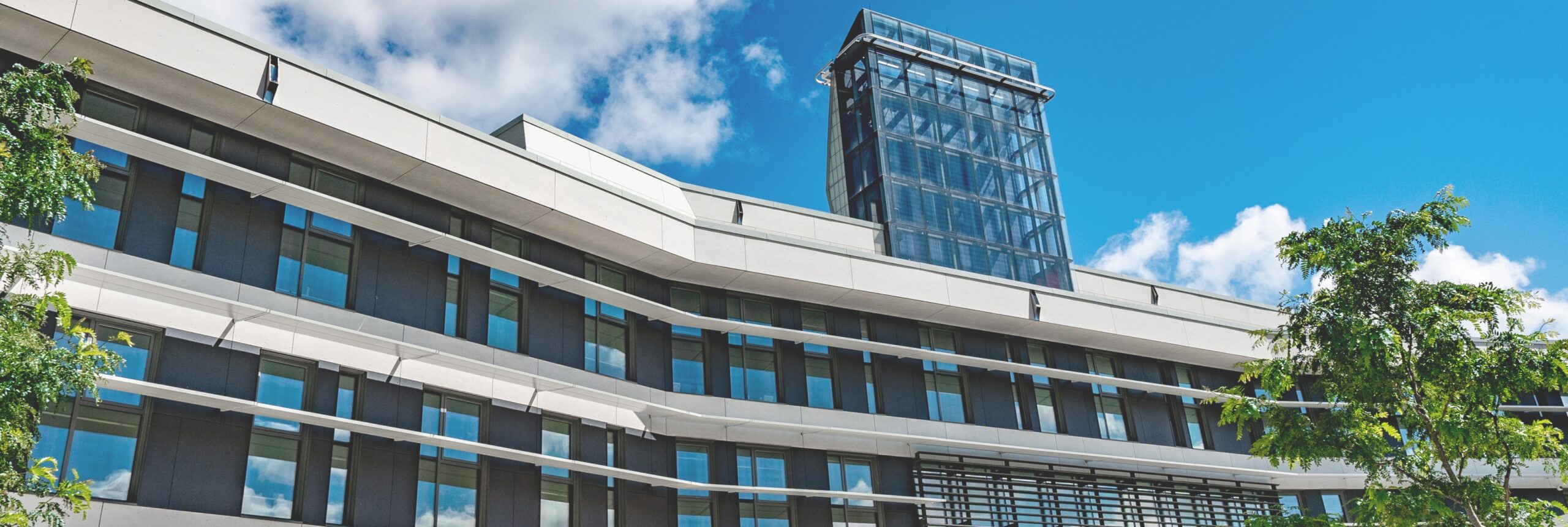 Exterior photo of The Rob and Cheryl McEwen Graduate Study & Research building.