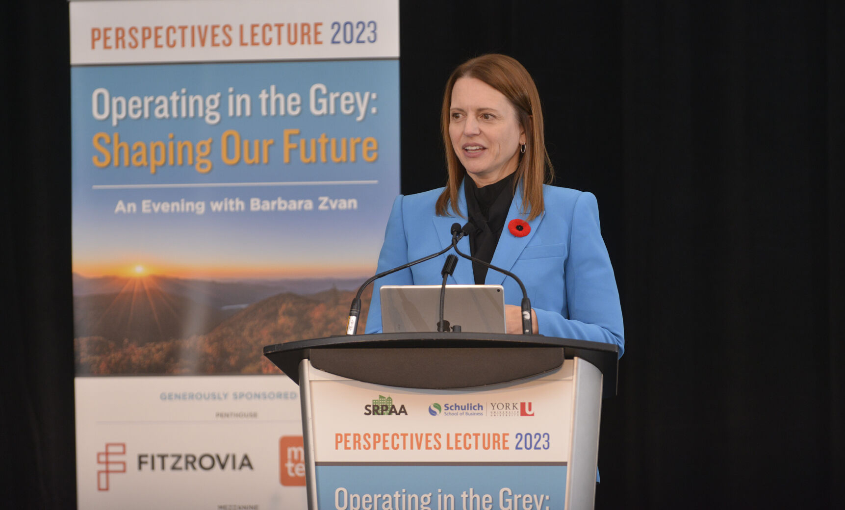 A female keynote speaker standing at a podium during the Perspectives Lecture 2023.